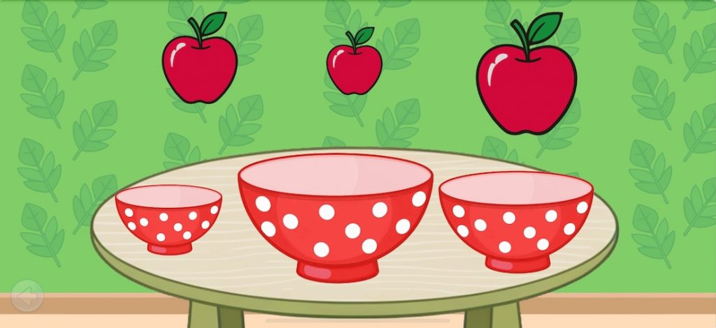 Toddler playing with stacking cups in order of size to learn spatial concepts